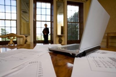 close-up-shot-of-a-laptop-and-paperwork-lying-on-a-2026-01-11-08-42-58-utc