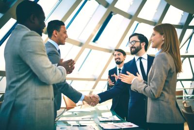successful-business-professionals-congratulating-e-2026-03-09-02-52-49-utc