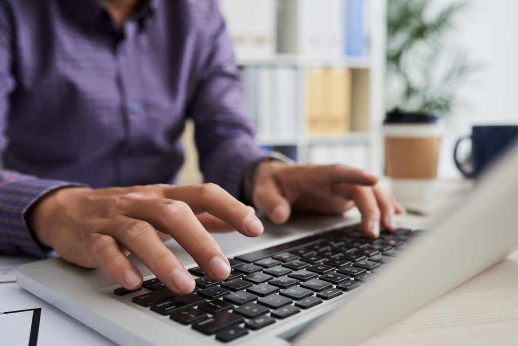 hands-typing-on-a-laptop-in-an-office-2026-01-08-00-08-18-utc