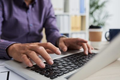 hands-typing-on-a-laptop-in-an-office-2026-01-08-00-08-18-utc