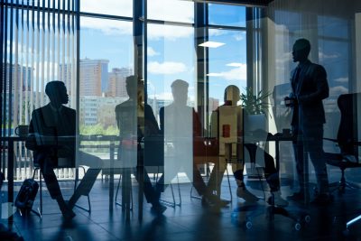 silhouetted-business-team-meeting-in-modern-office-2026-01-05-23-12-19-utc